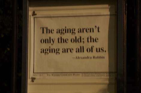 Saying on wall: The ageing aren't only the old; the ageing are all of us